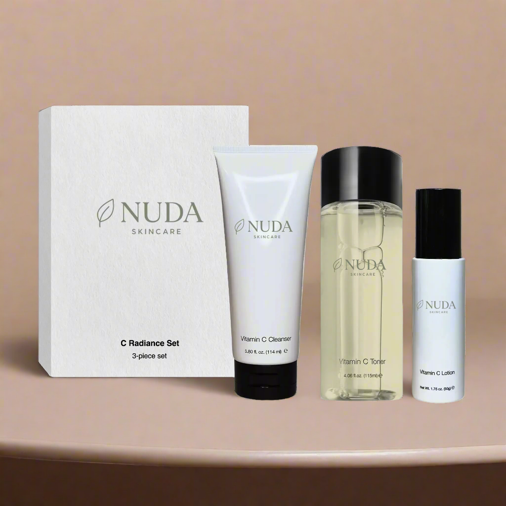 NUDA skincare product set on a beige background

