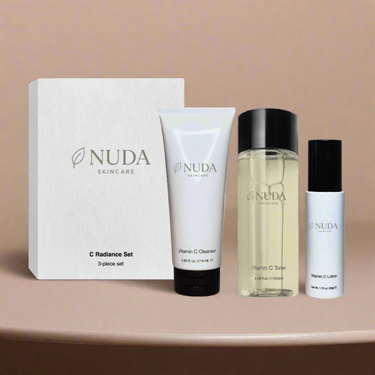 NUDA skincare product set on a beige background

